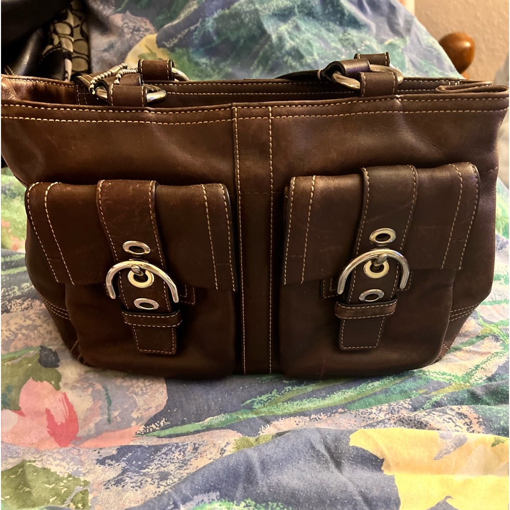 Coach purse only used a few times Dark brown with that coach hang tag.